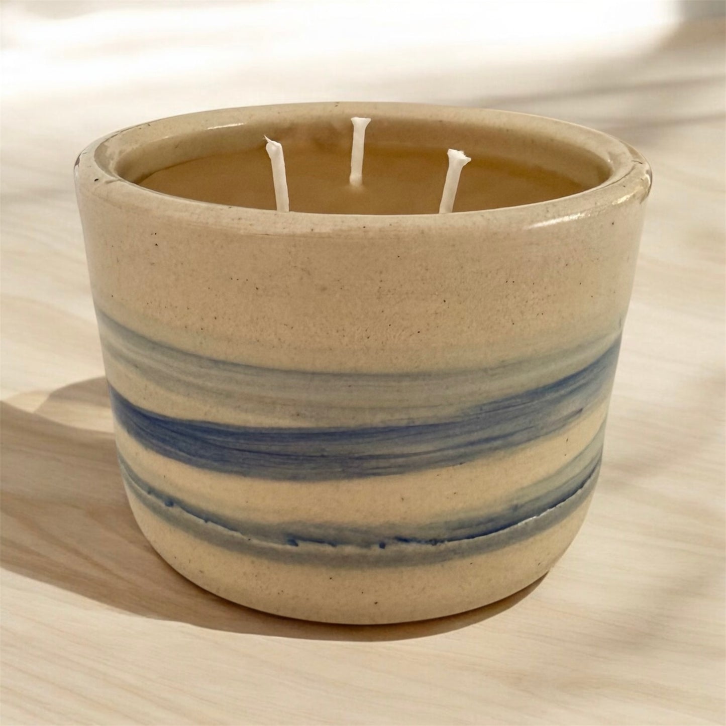 “Flowing River” pure beeswax candle in local pottery