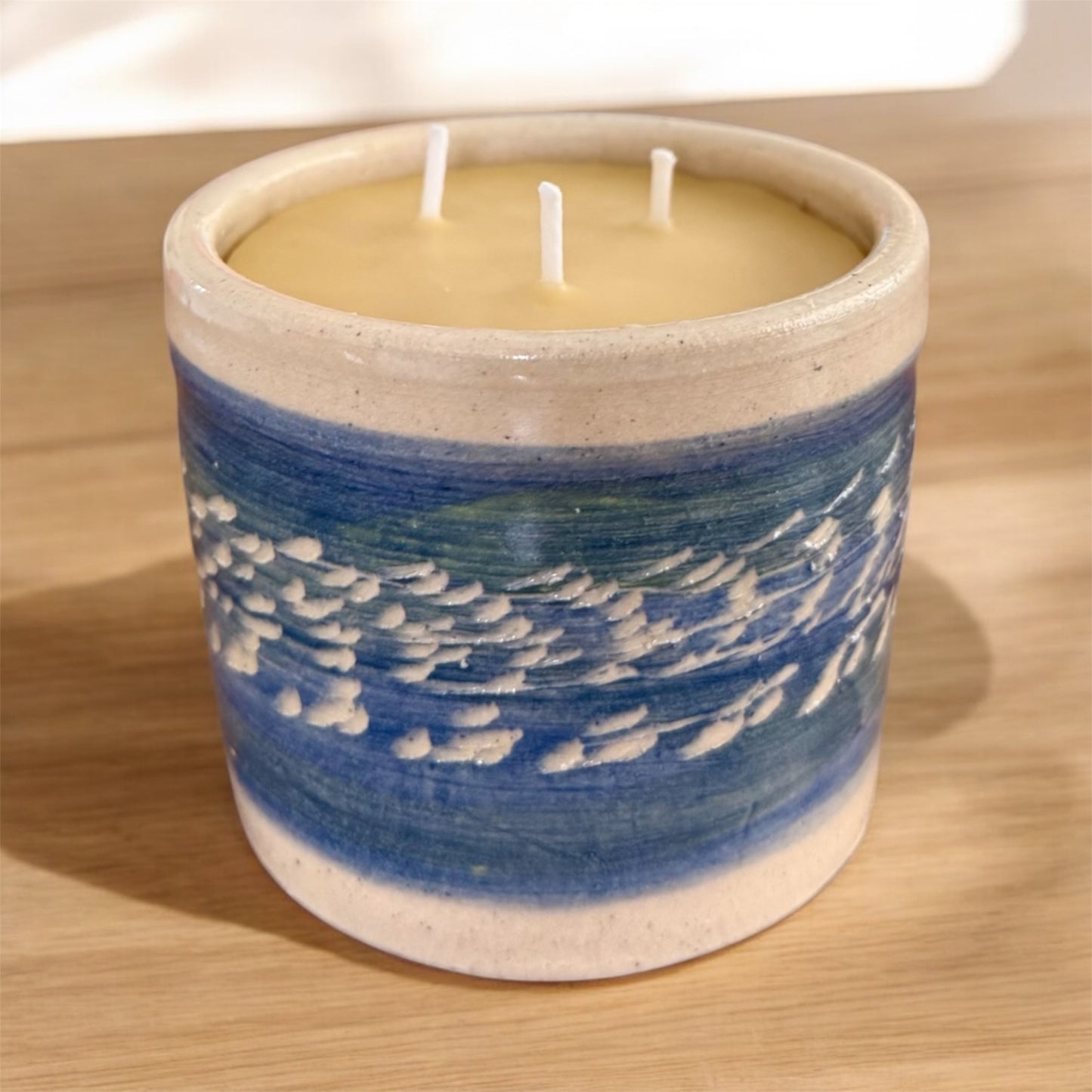 “Blue Horizon” pure beeswax candle in local pottery