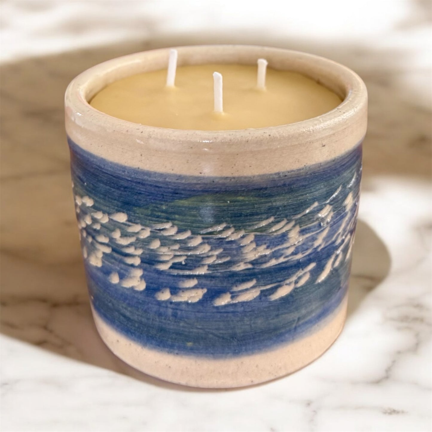 “Blue Horizon” pure beeswax candle in local pottery